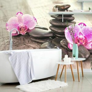 Samoprzylepna fototapeta orchidea i zen kamienie na drewnie obraz