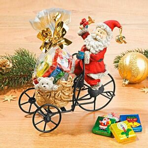 Święty Mikołaj na trójkołowym rowerze obraz